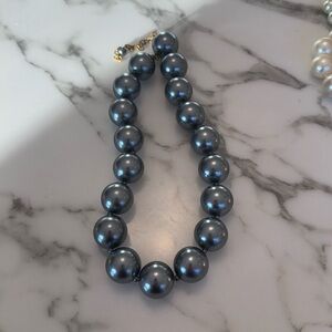 Used: Plastic bead necklace, shiny metallic